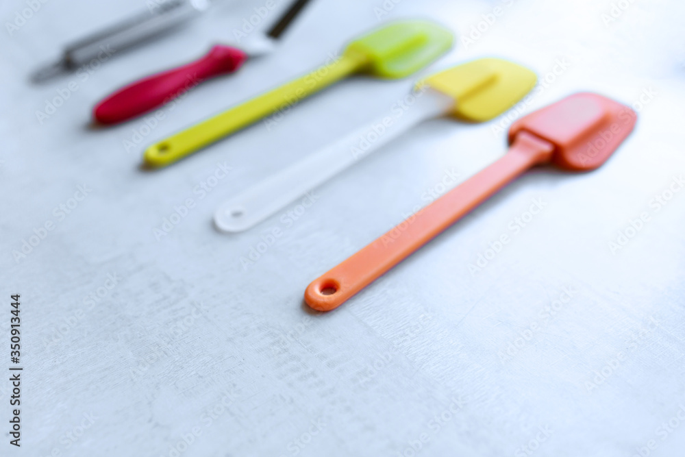 Set of multi-colored silicone spatulas, kitchen tools. Sweet pastries, recipes, cooking Set of multi-colored silicone spatulas, kitchen tools. Sweet pastries, recipes, cooking