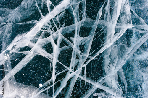 Beautiful ice of Lake Baikal with abstract cracks