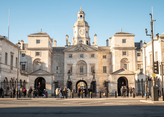 Horse Guards, London, UK. The Whitehall entrance to Horse Guards, an old military landmark with tourists admiring its ceremonial guards on horseback.