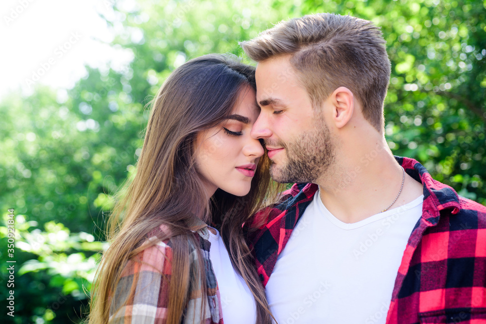Never boring. couple in love. Hiking. hipster couple outdoor. family weekend. romantic date. man and woman in checkered shirt relax in park. valentines day. summer camping in forest Never boring. couple in love. Hiking. hipster couple outdoor. family weekend. romantic date. man and woman in checkered shirt relax in park. valentines day. summer camping in forest