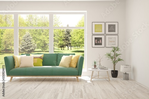 White living room with sofa and summer landscape in window. Scandinavian interior design. 3D illustration