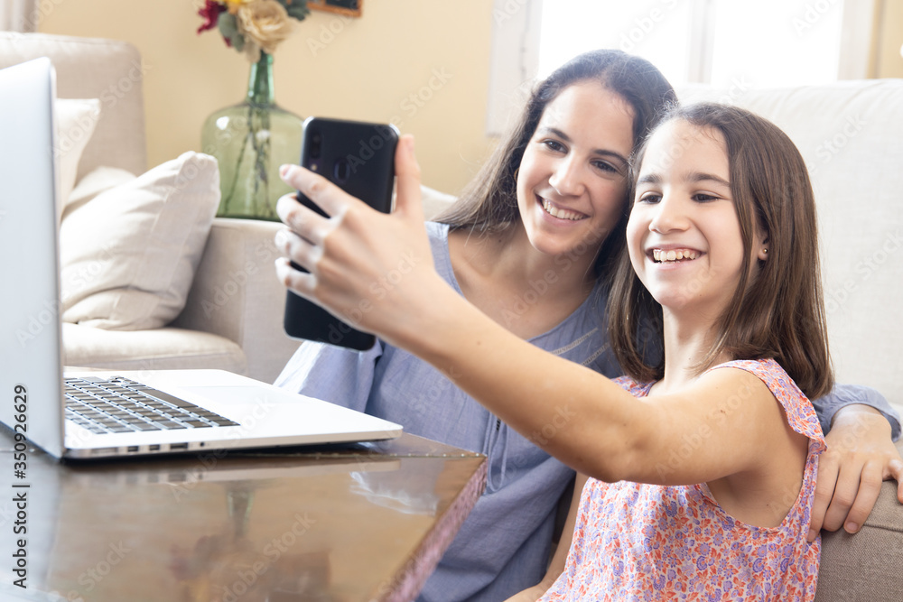 Two sisters making a video call Two sisters making a video call
