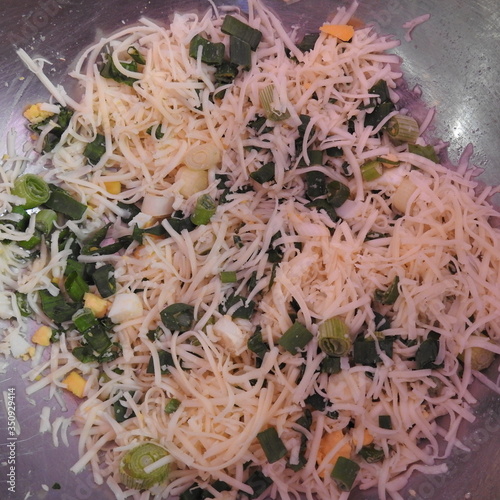 grated cheese with herbs