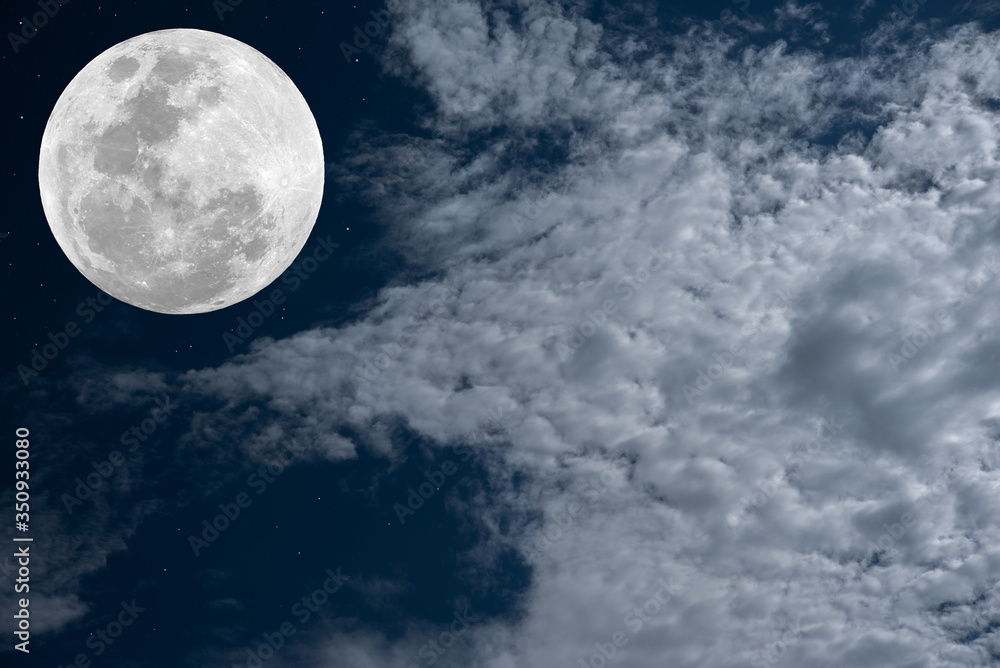 Full moon and white clouds on the sky.