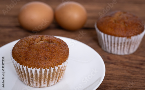 Banana cupcakes on wood table