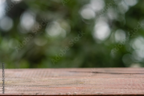 wooden table in nature in summer. close-up, space for text