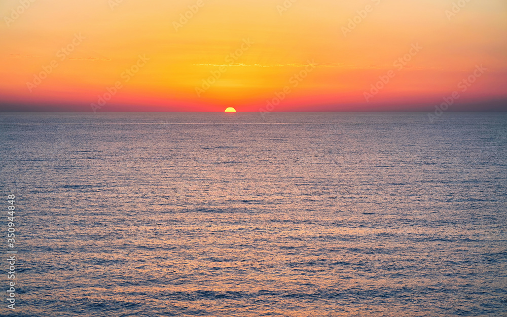 Fototapeta premium Sunrise at Mediterranian sea in Palermo reflex