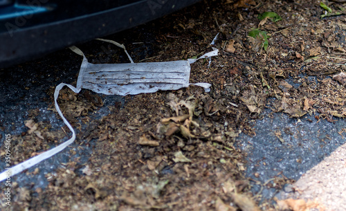 Wallpaper Mural Used and very dirty mask lying on the floor. It's been there a while. The debris from covid19. Torontodigital.ca