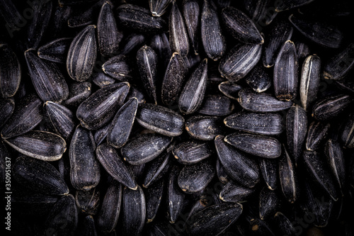 Top view of black sunflower seeds. Organic natural food background. Sunflower seeds are siutable for microgreens sprout