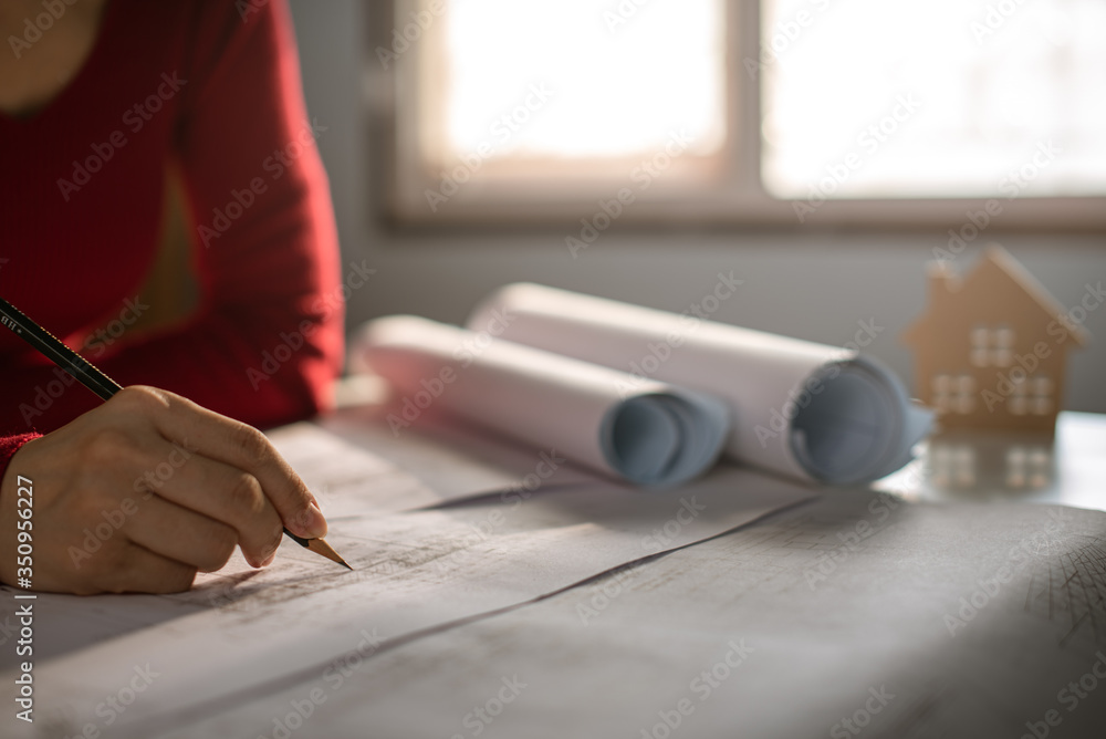 Architect working on blueprint. Architects workplace - architectural ...