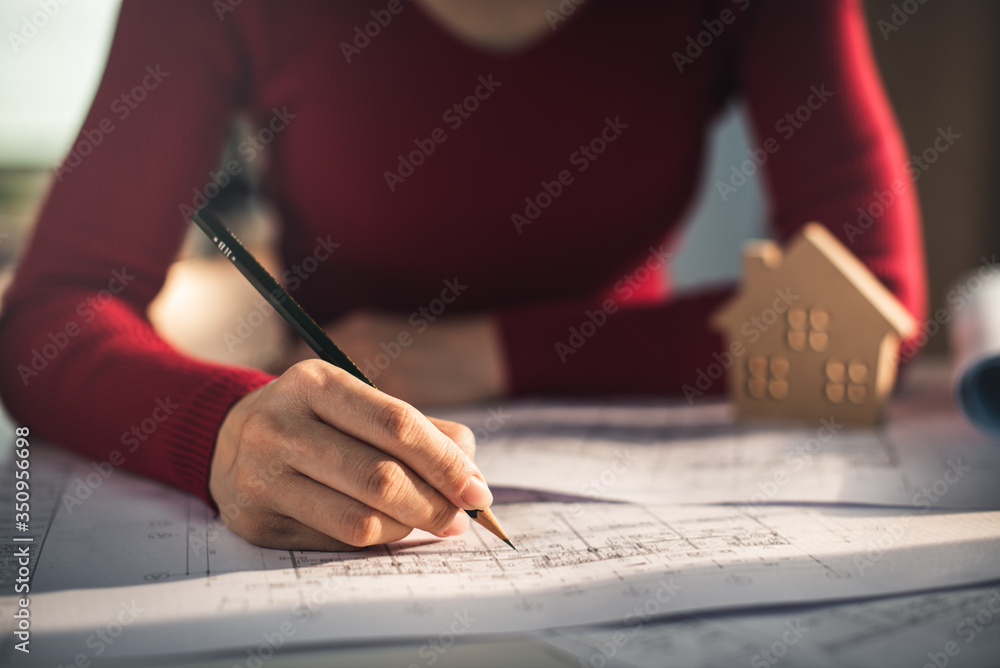 Architect working on blueprint. Architects workplace - architectural ...