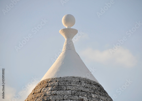 ALBEROBELLO, ITALY, EUROPE, AUTUMN 2019. Typical roof with ancient trulli construction technique made of gray cone-shaped stones with white spikes in the small town in southern Italy