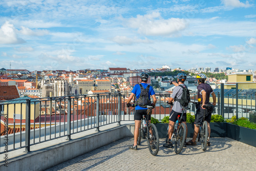 Three cyclists enjoying the view