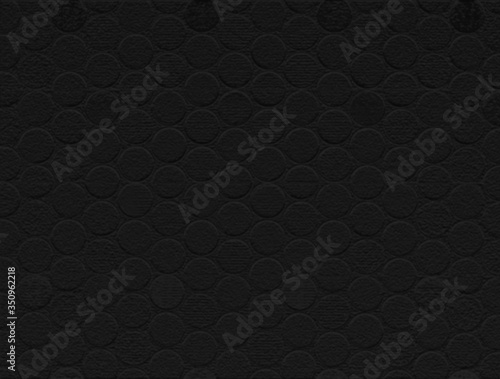 Textured graphic with black-on-black patterned 3-D bas relief dots, background, room for text