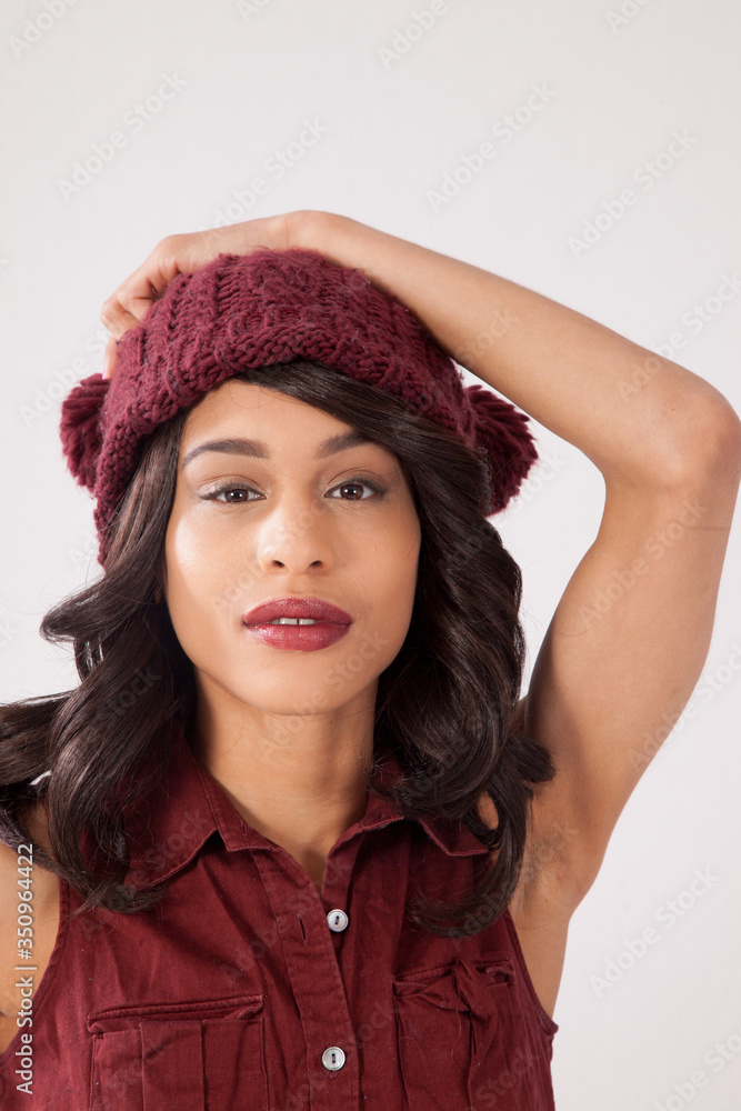 Pensive woman in a red knit cap Pensive woman in a red knit cap