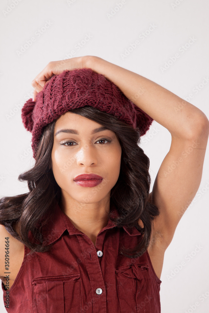Pensive woman in a red knit cap Pensive woman in a red knit cap