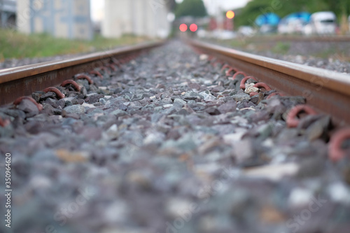 The close-up of Iron rails for the railway on gravel stones