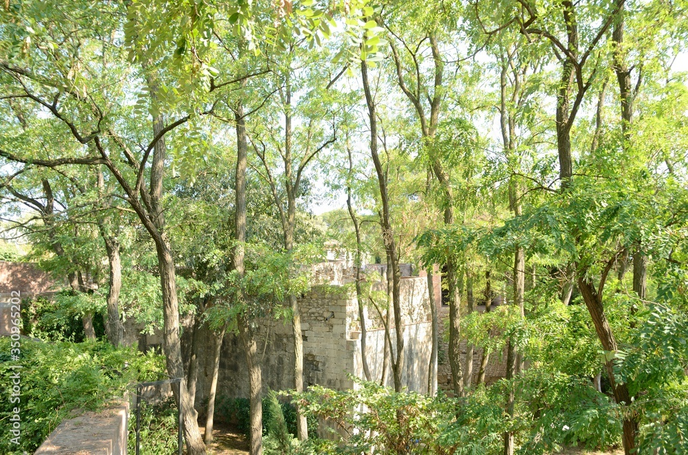 Old stone building at garden in Girona, Spain Old stone building at garden in Girona, Spain
