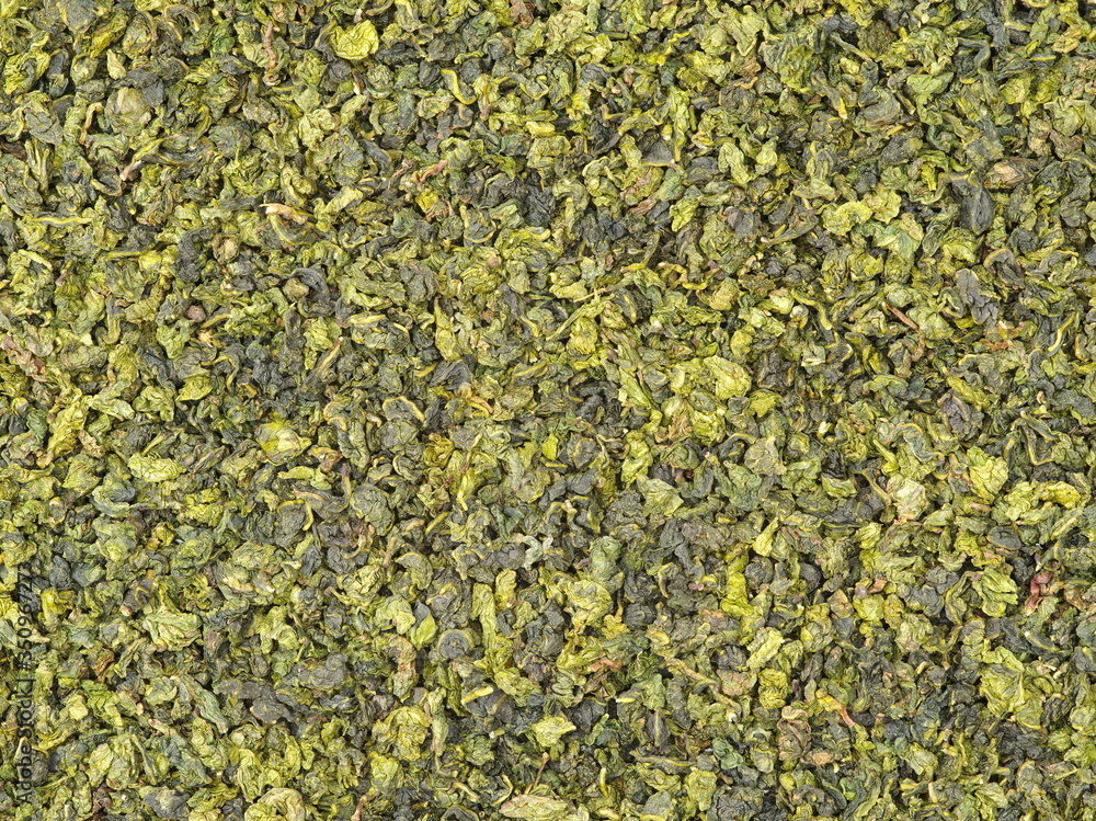 Dry green oolong tea leaves texture background Dry green oolong tea leaves texture background