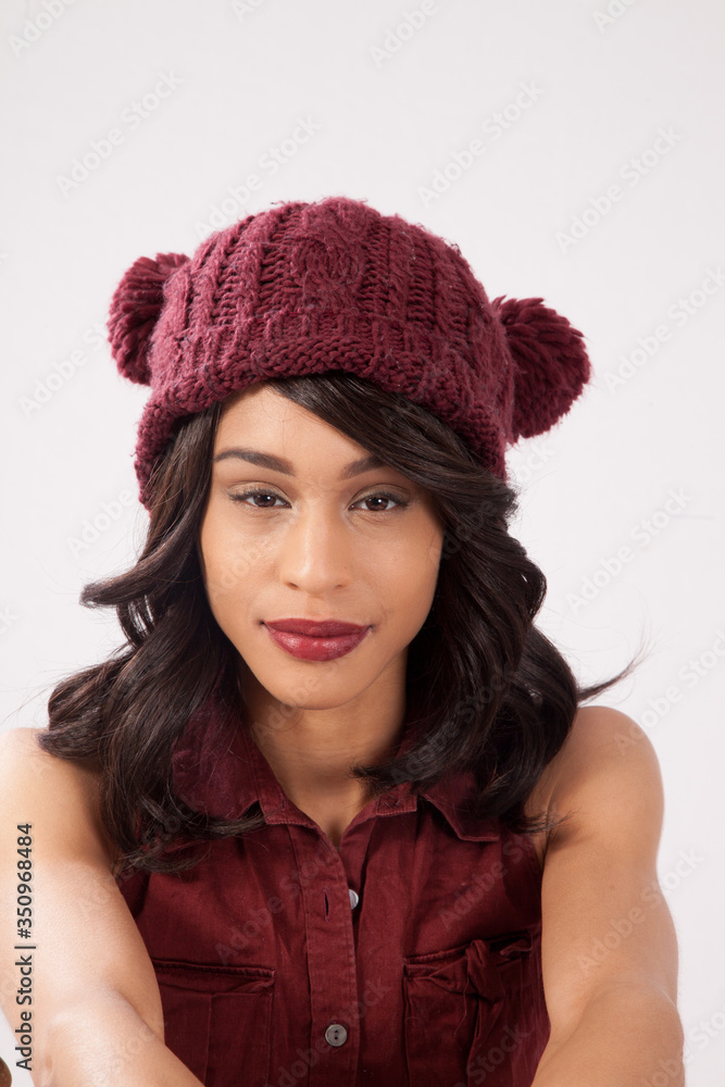 Pensive woman in a red knit cap Pensive woman in a red knit cap