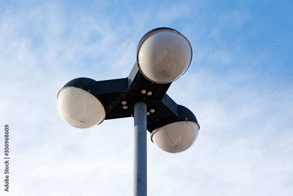 street lamp with three bright spots, feels a little extraterrestrial street lamp with three bright spots, feels a little extraterrestrial