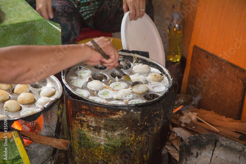 Typical coconut pancakes cooked in the alleys of central Phnom Penh