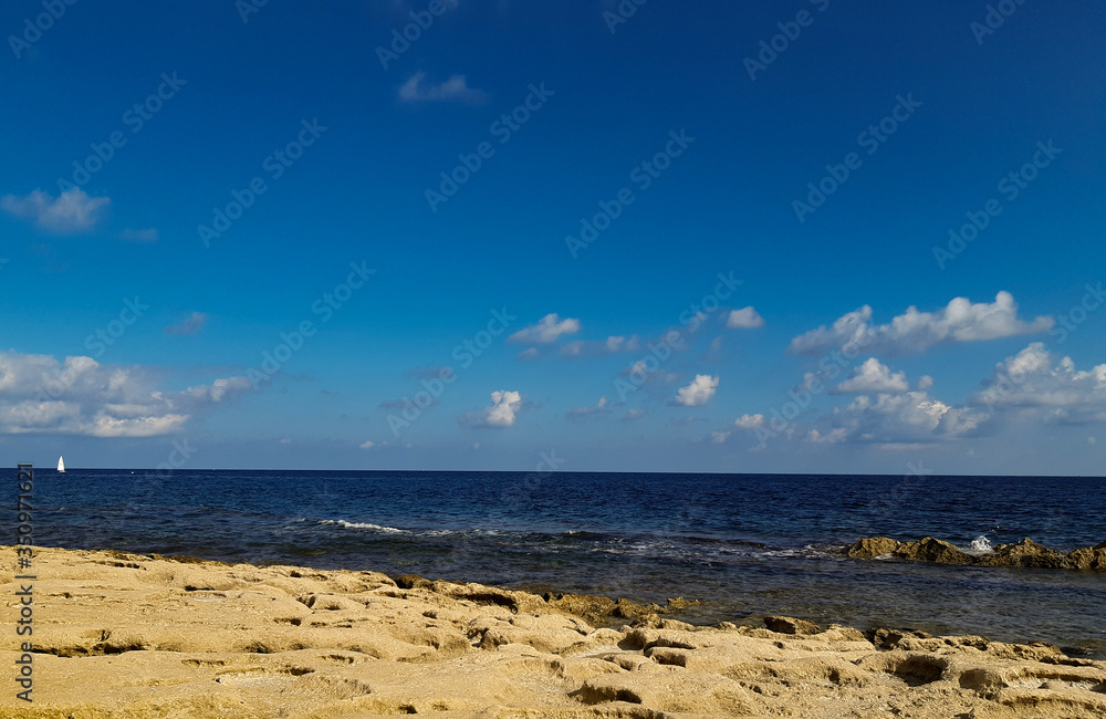Sea view with blue sky from rocks in Valetta, Malta