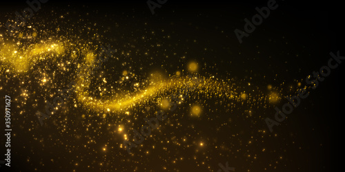 Magical festive background with sparkling golden particles and glowing light effect