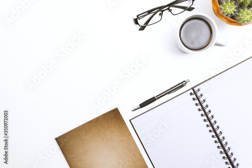 High Angle View Of Books With Black Coffee And Eyeglasses Over White Background