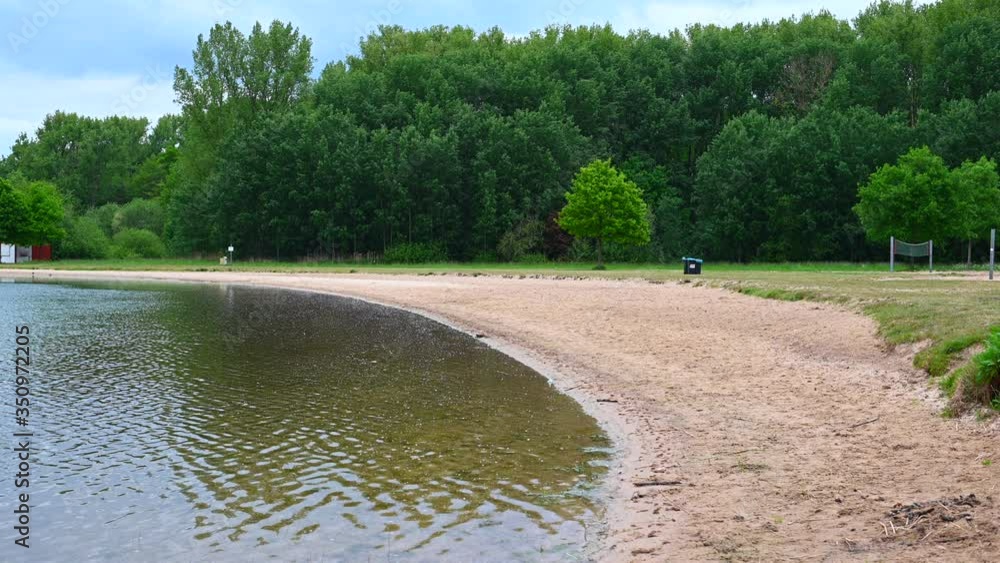 there is a small bathing beach on an excavated lake which is currently not used due to the corona time there is a small bathing beach on an excavated lake which is currently not used due to the corona time