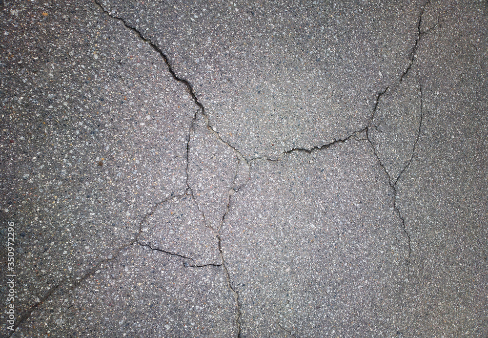 Obraz premium Black & white cracked asphalt background