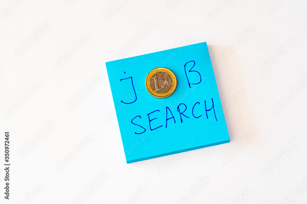 Looking for a job concept - Blue notebook with job search phrase. One euro money. Flat lay white background