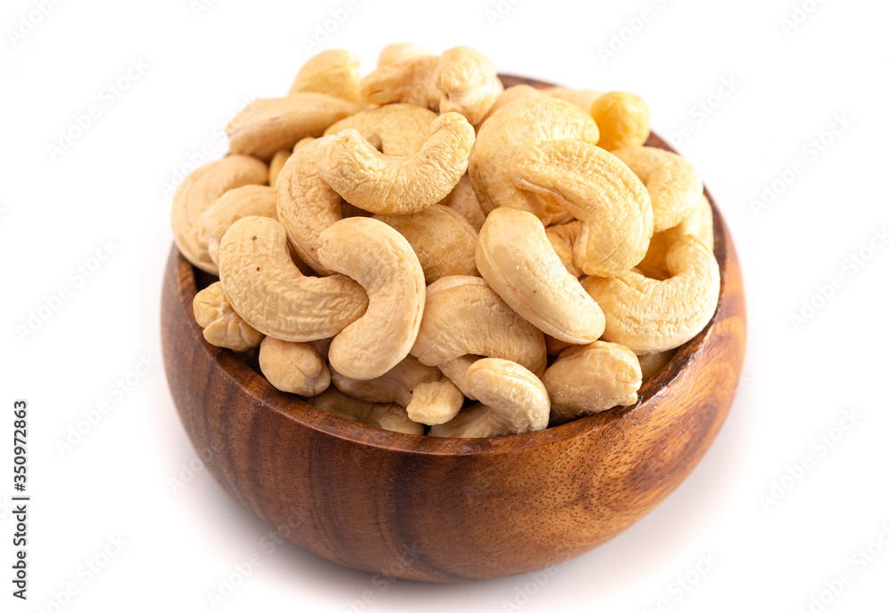 Bowl of Raw Natural Cashews Isolated on a White Background Bowl of Raw Natural Cashews Isolated on a White Background