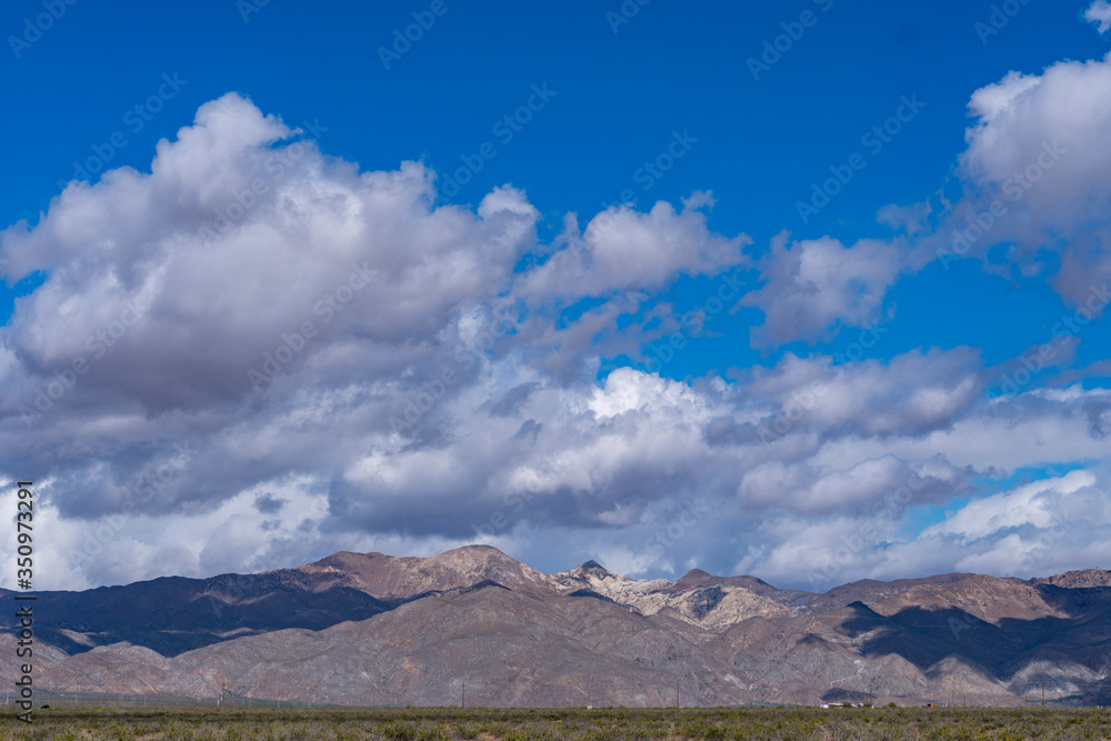 clouds over the mojave desert mountains