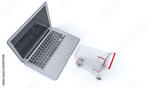 shopping cart on a notebook keyboard. online shopping concept.