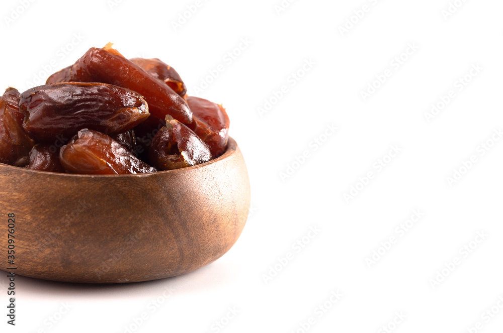 Bowl of Pitted Dates Isolated on a White Background