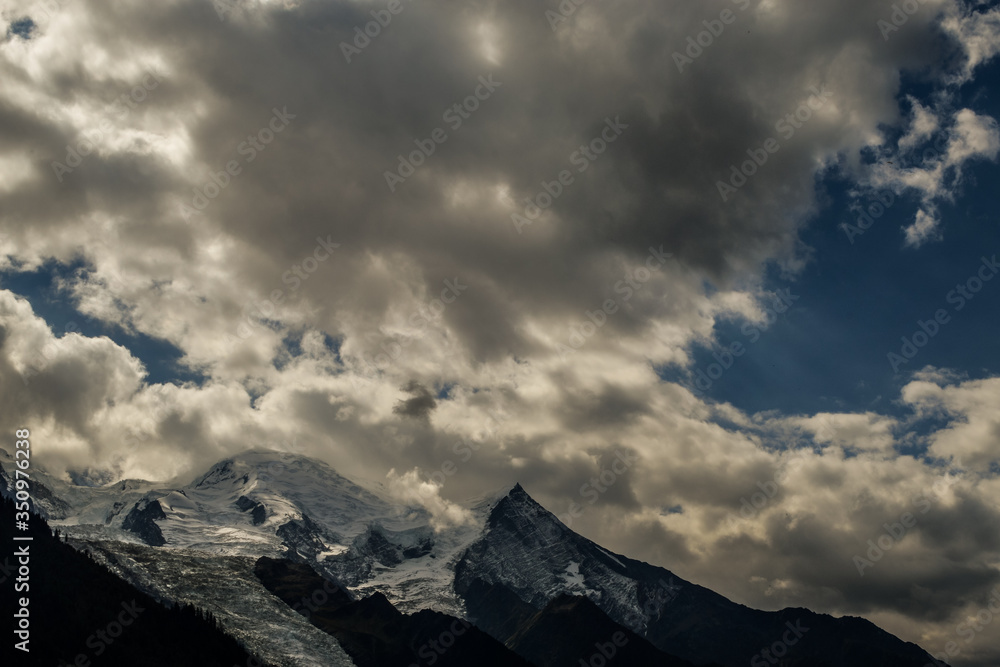 French Alps mountains in a cloudy summer day, seen from Chamonix, Haute Savoy, France.