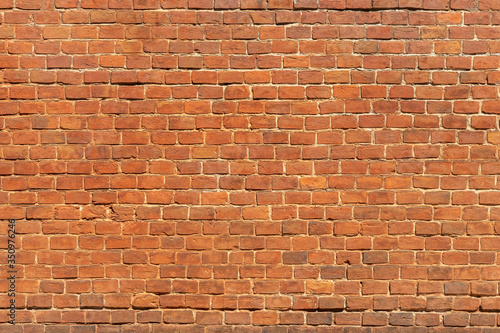 Grunge red brick wall background.