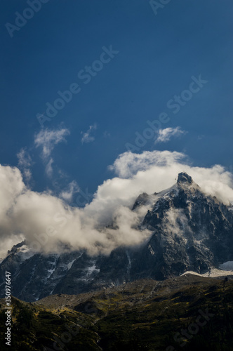 French Alps mountains in a cloudy summer day, seen from Chamonix, Haute Savoy, France. © sebastianosecondi