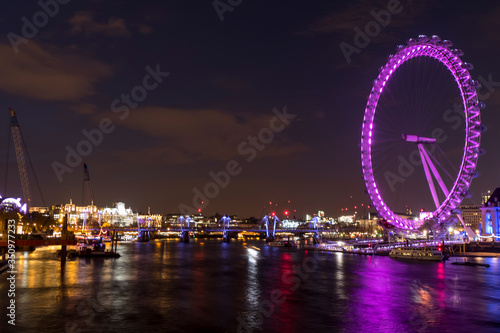 Photography Night photo of London with illuminated London Eye and Thames