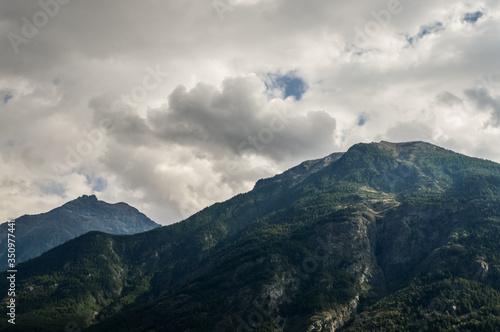 Italian Alps mountains in a cloudy september day  seen from Courmayeur area  Aosta Valley  Italy.