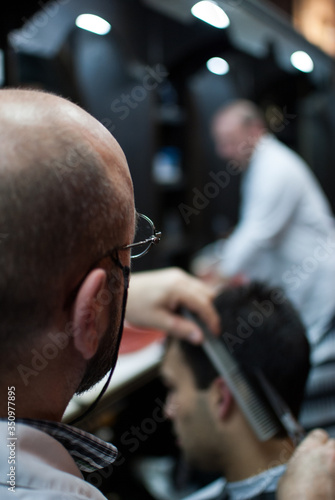 barber making a haircut