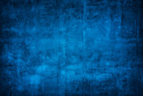 Blue wall background with darker black grungy border and vintage texture design.