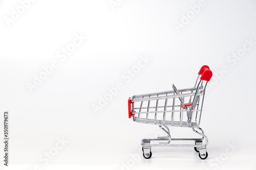 Empty trolley cart on a white background. Shopping, sale, finance, and business concept. © AbdulRazak
