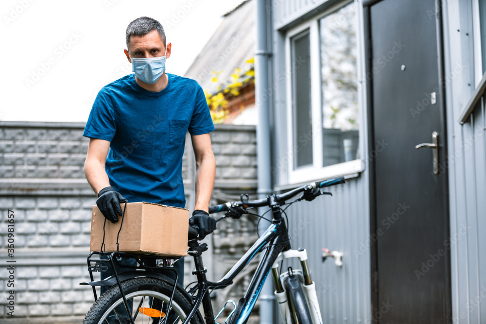 pandemic home delivery of food by bicycle. social distancing for infection risk pandemic home delivery of food by bicycle. social distancing for infection risk