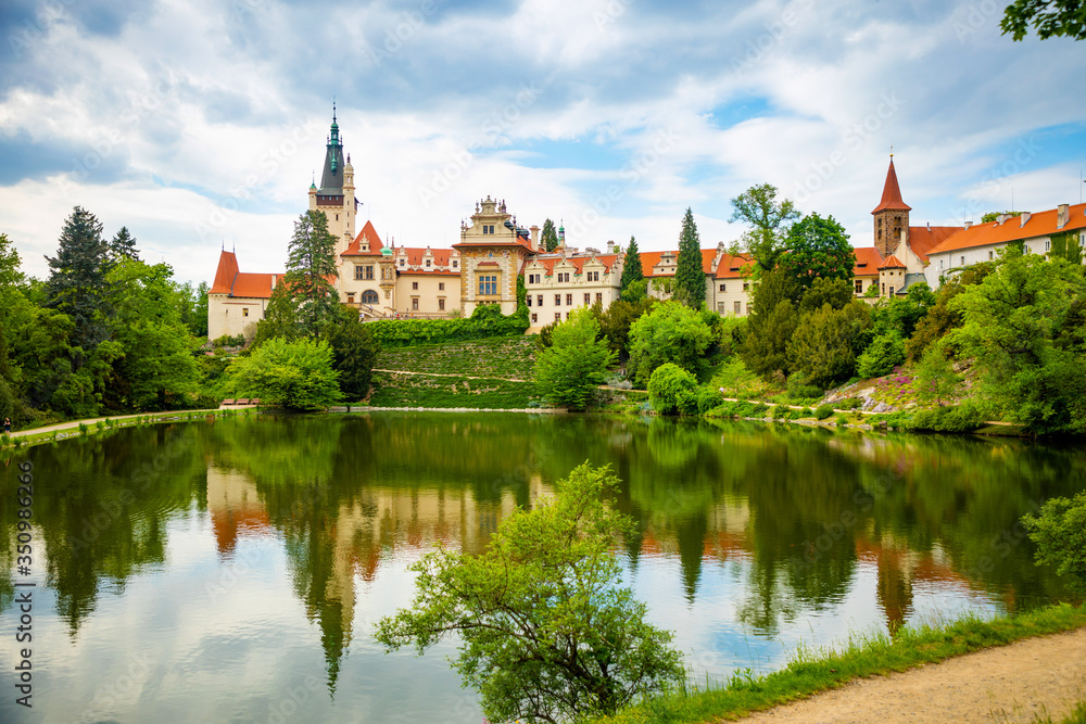 Castle with reflection in pond in spring time in Pruhonice, Czech Republic Castle with reflection in pond in spring time in Pruhonice, Czech Republic
