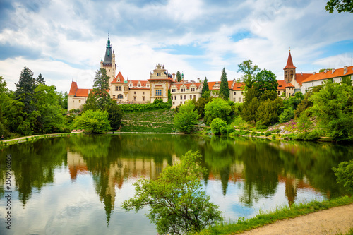 Castle with reflection in pond in spring time in Pruhonice, Czech Republic