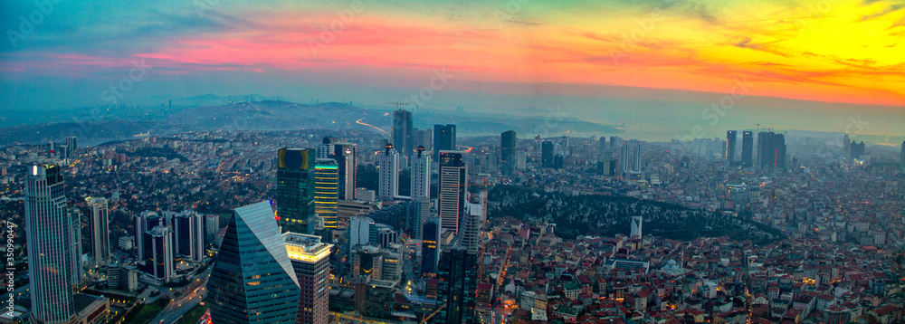 Naklejka premium Istanbul sunset skyline aerial panoramic view from Sapphire tower, Levent Financial District, Istanbul Turkey. Beautiful Bosphorus Bridge, business towers, modern offices, central banks, skyscrapers