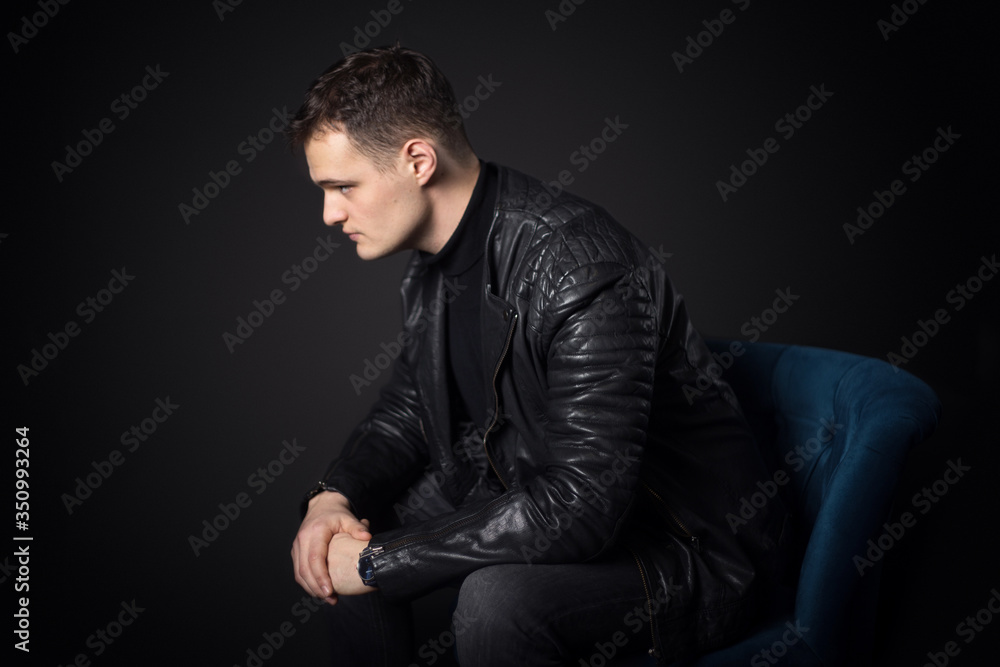 Portrait of an attractive man in the studio on a black background. Portrait of an attractive man in the studio on a black background.