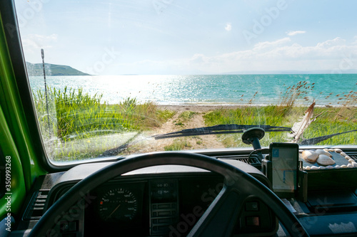 Vintage minivan camper heading straight to the beach. Interior view.